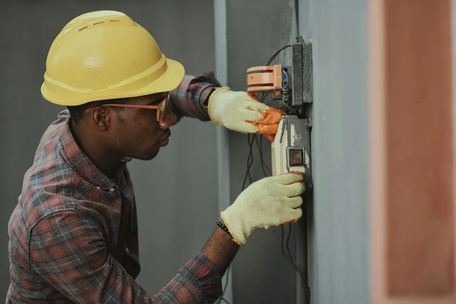 Professional appliance technician working on control board
